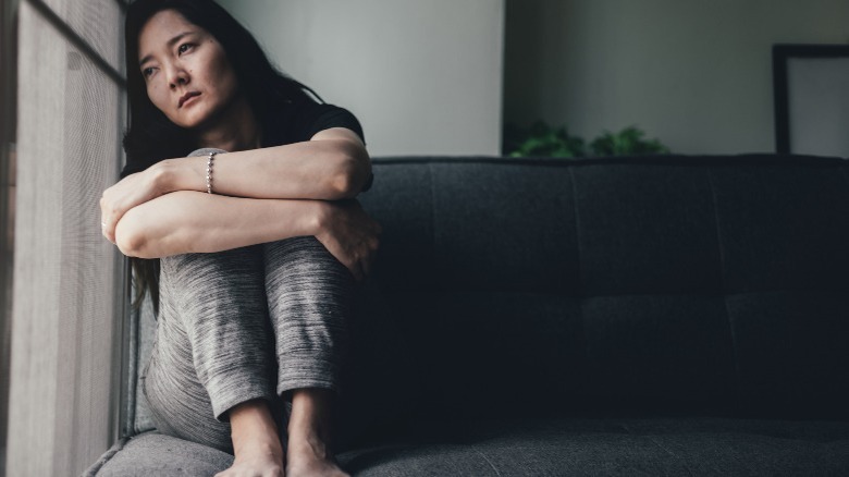 Sad woman sitting alone