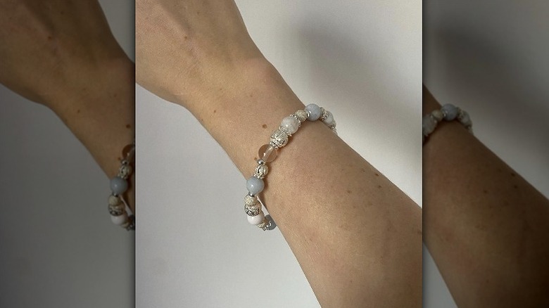 person wearing celestite bracelet