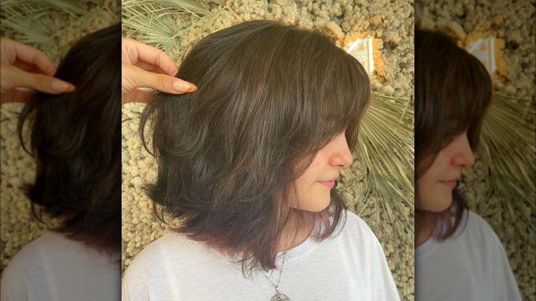 A cub haircut with curtain bangs