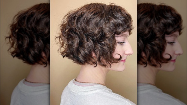 A curly cub haircut with bangs