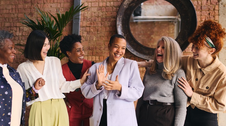 women clapping for each other