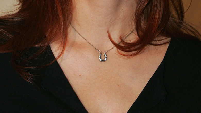 A silver and diamond horseshoe necklace