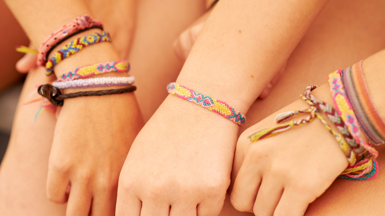 Three friends with unique bracelets