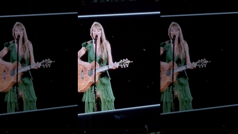 Taylor Swift singing with guitar