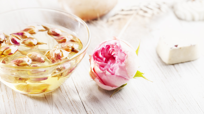 Bowl of rose petals in oil