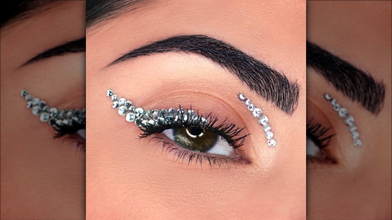 person wearing crystal eyeliner