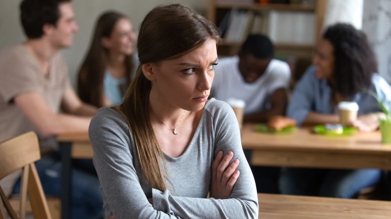 Woman feeling drained with friends