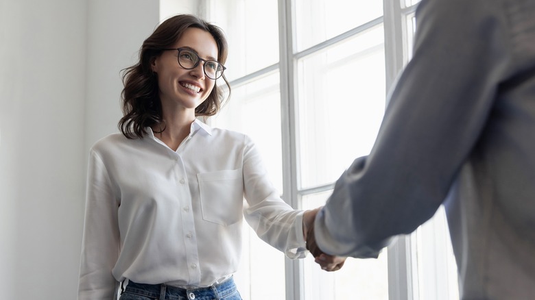 Woman shaking hands