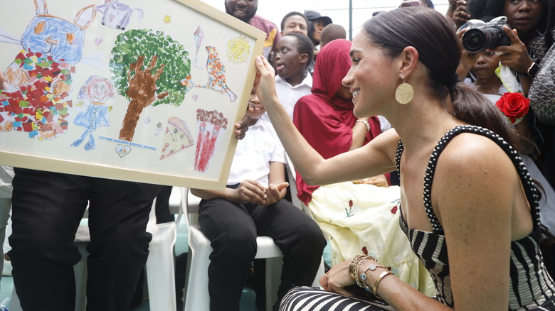 Meghan Markle looking at drawings