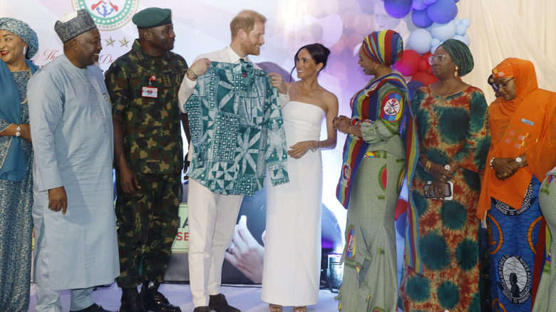 Prince Harry green shirt Meghan Markle white dress