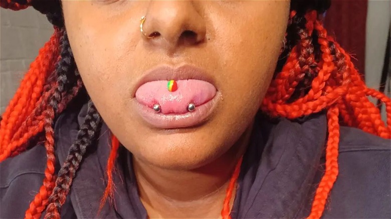 person with snake eyes piercing