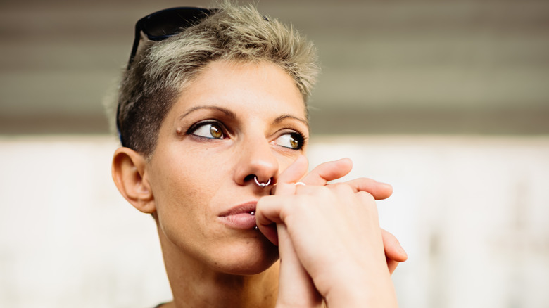 Woman with arm tattoos