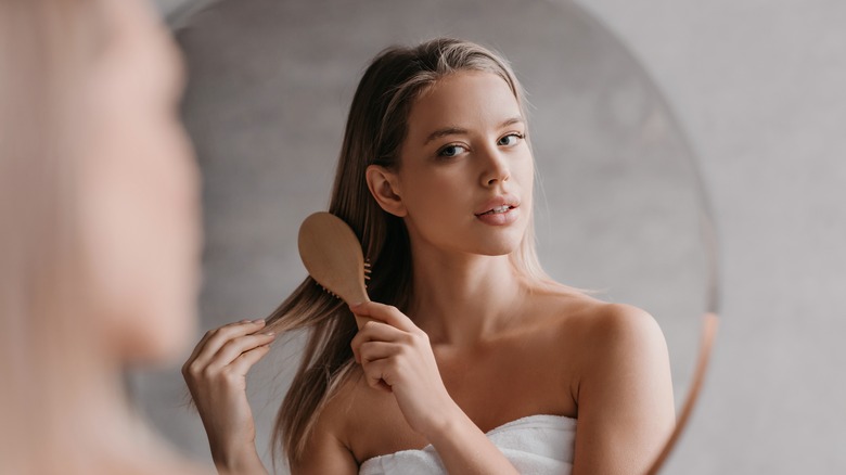 A woman brushing her hair