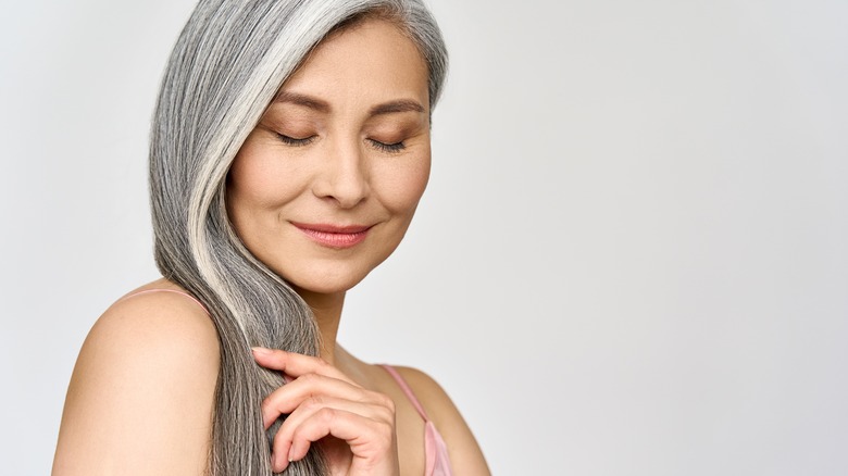 A woman with long gray hair