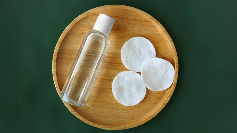 Micellar water in a bowl with cotton pads