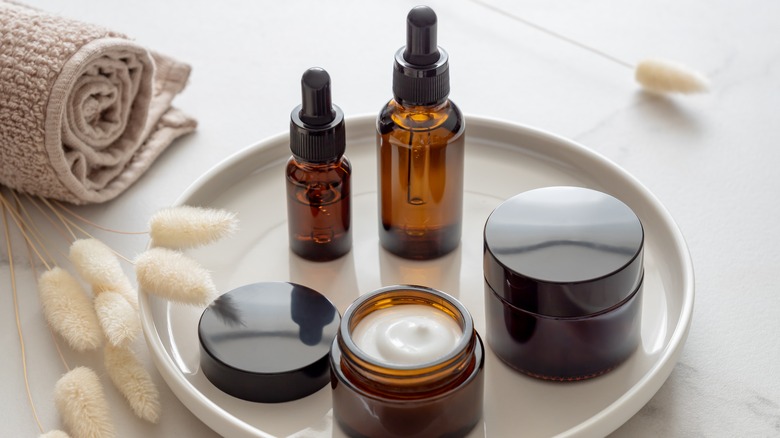 Different skincare products placed on a tray