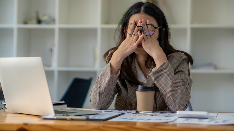 Women looking stressed while working