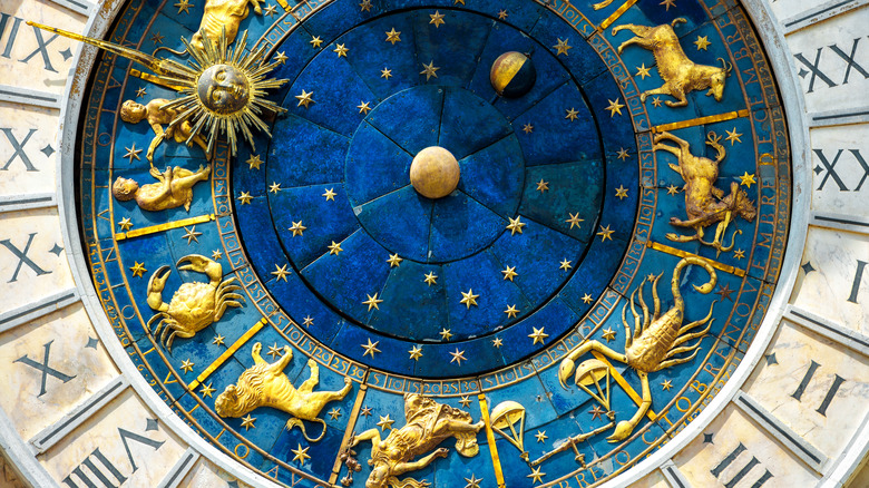 A close up of an astrological chart or clock