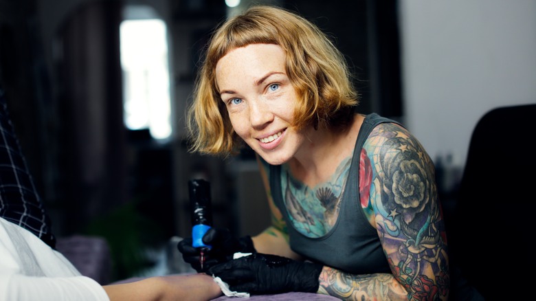 Tattoo artist smiling 