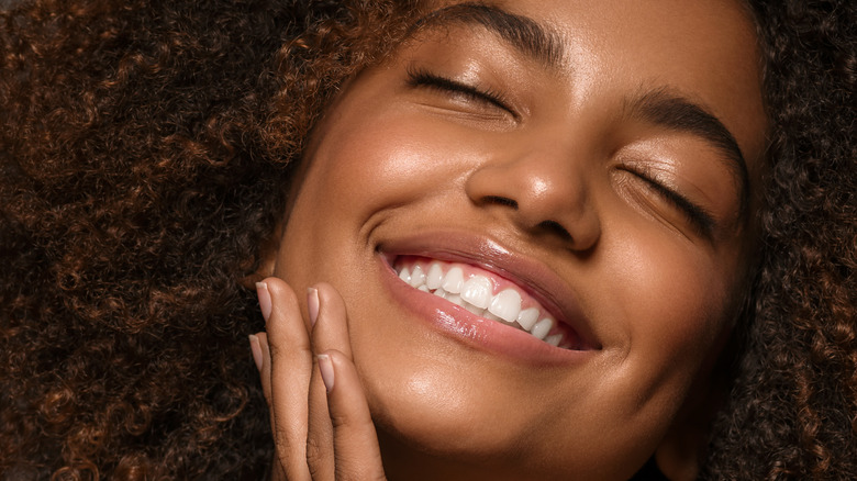 Woman with sheer coverage makeup 