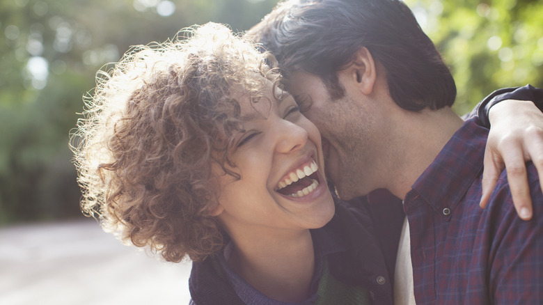 Couple laughing and embracing  