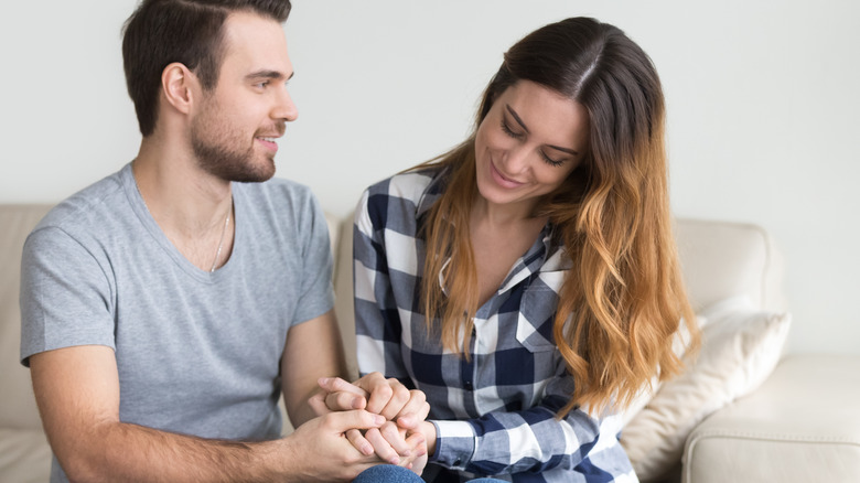 Couple holding hands