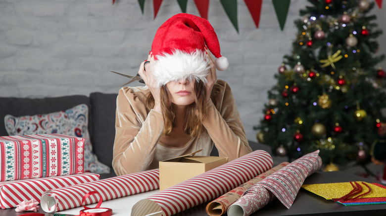 stressed woman in Santa hat 