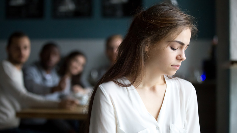 woman feeling judged by friends