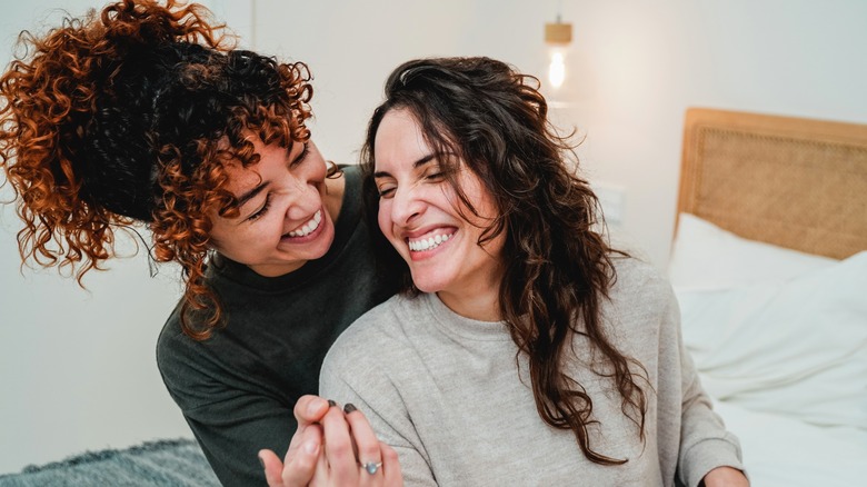 lesbian couple smiling