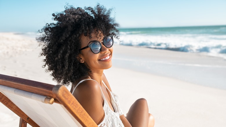 woman on beach smiling