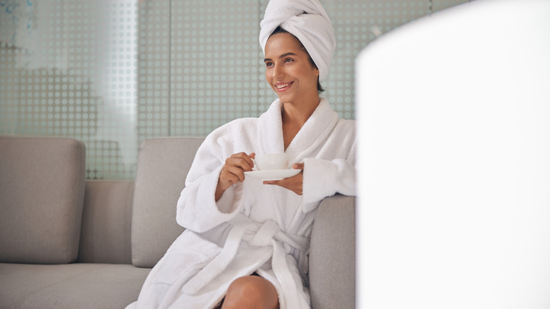 Woman in a bathrobe at spa