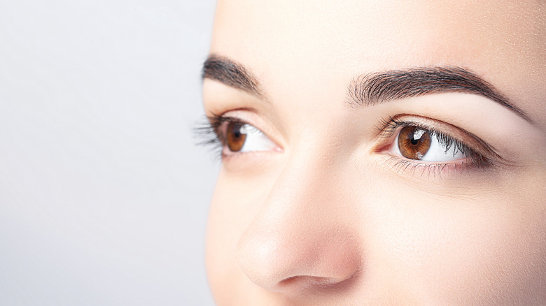 Close-up woman staring into distance