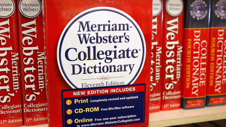 Merriam Webster's dictionaries on shelf 