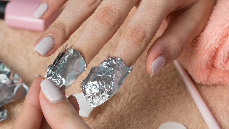 Nails being removed with foil