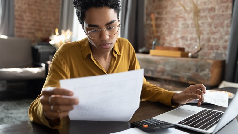 Woman looking at paperwork 