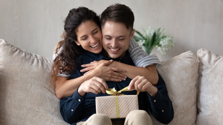 Married couple giving a gift 