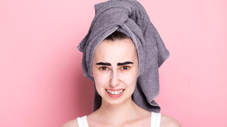 Woman with a botched eyebrow tint