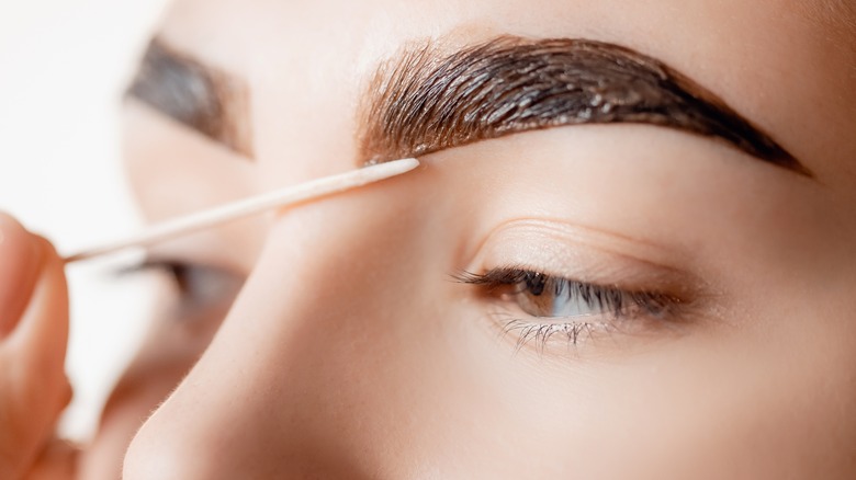 Woman getting an eyebrow tint