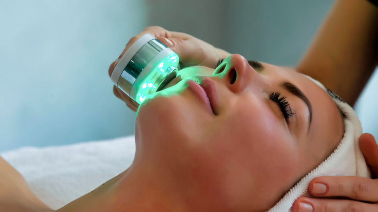 A woman getting LED light therapy