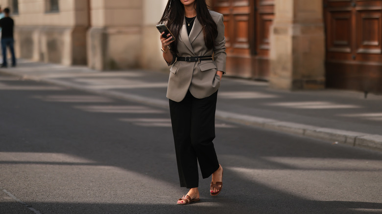 Person wearing blazer and sandals