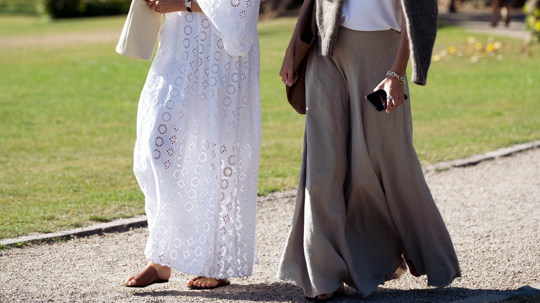 Two people in long dresses