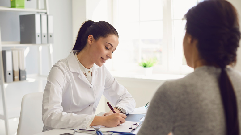 Woman speaking with a female doctor