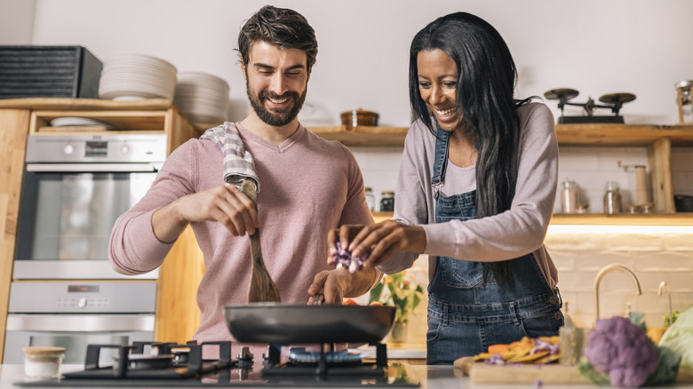 couple cooking together