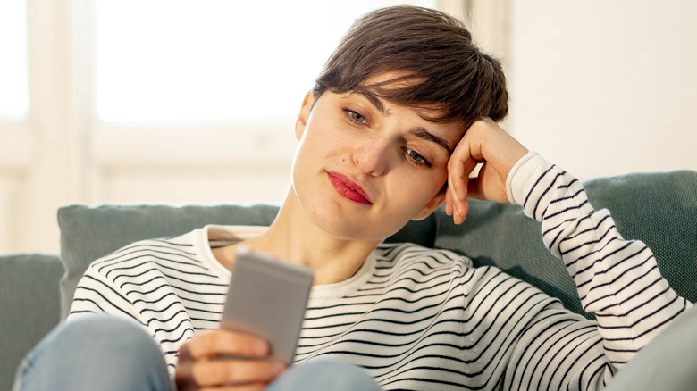 woman holding phone