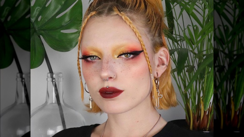 Woman with no eyebrows with colorful eyeshadow