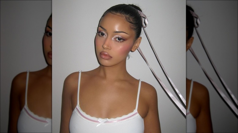 Woman with thin lifted and arched brows