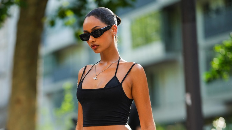 Woman posing with visible bra straps