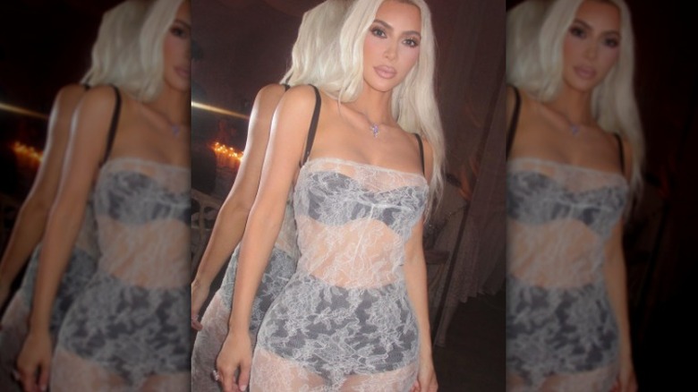 Sheer dress layered over an underwear set