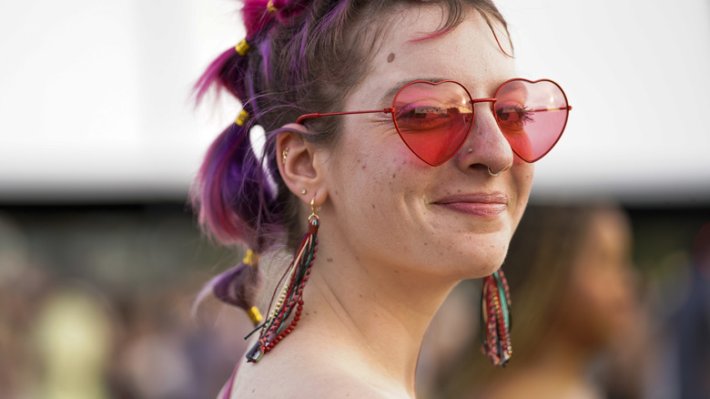 Colorful woman wearing heart sunglassses