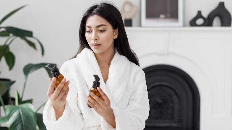 woman looking at skincare products